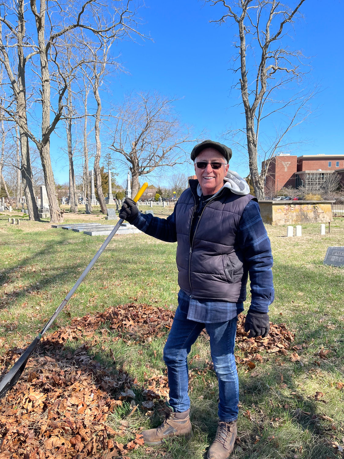 Patchogue Village trustee Joe Keyes pitches in at a previous Lakeview Cemeteries work day.
